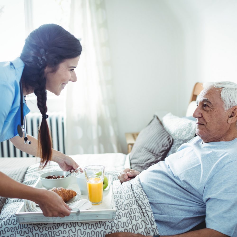 nurse-serving-breakfast-to-senior-man.jpg nurse-serving-breakfast-to-senior-man.jpg